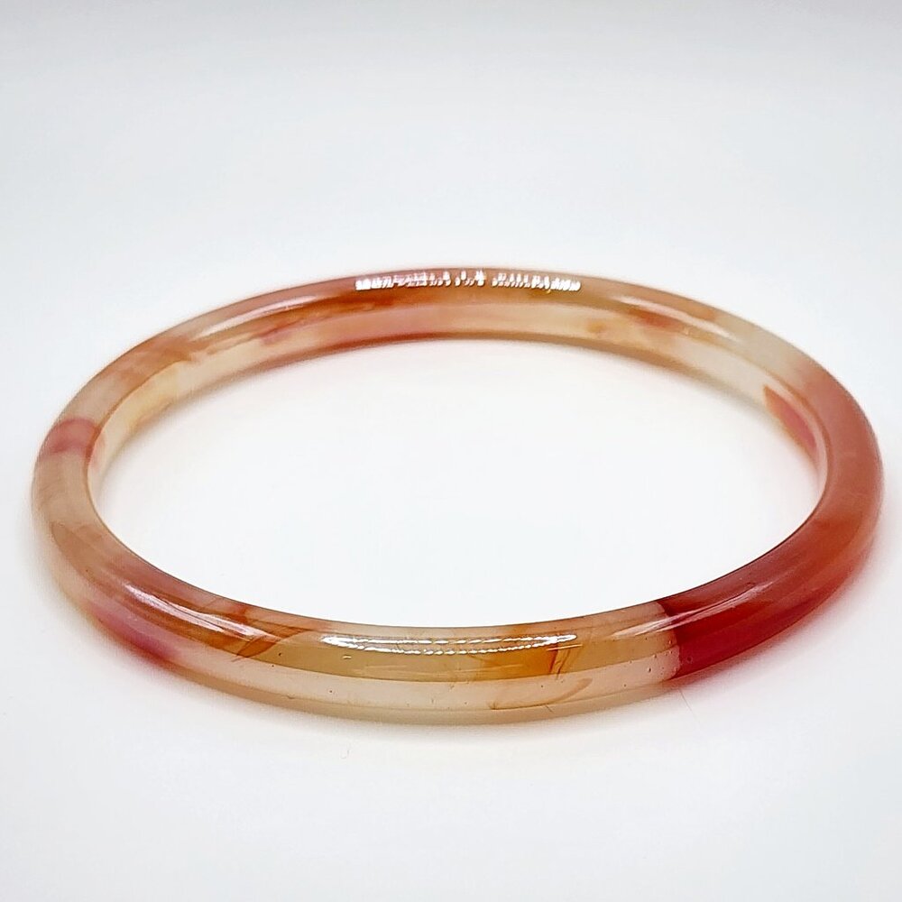 Warm tone banded glass bracelet with iridescent coating